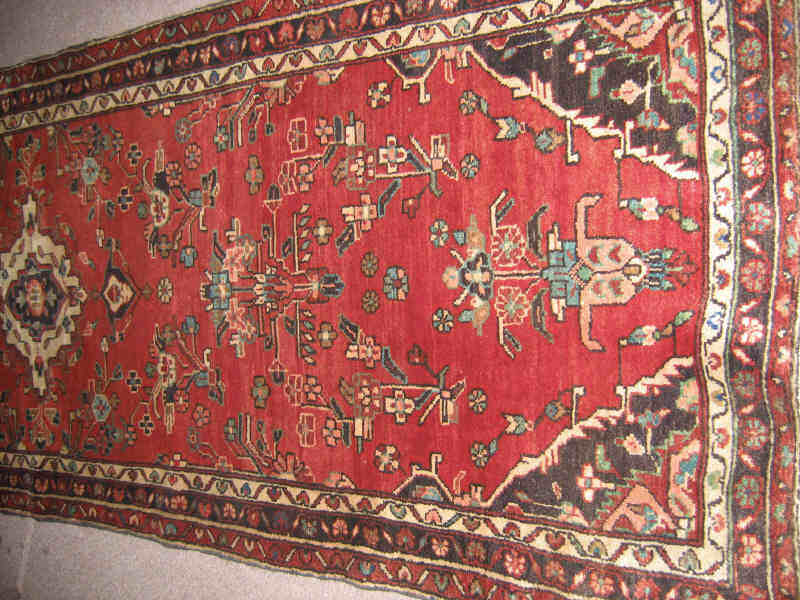 Appraisal: HAMADAN LONG RUG The abrashed salmon field of angular floral