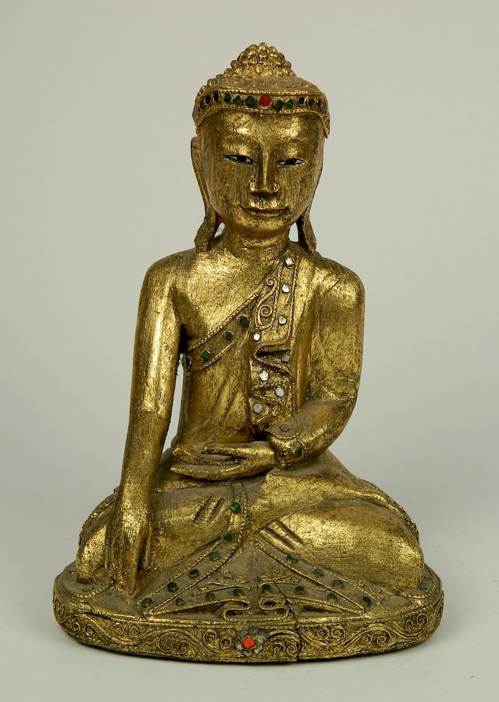 Appraisal: Carved and painted wood Buddha thc Carved and gilded wood