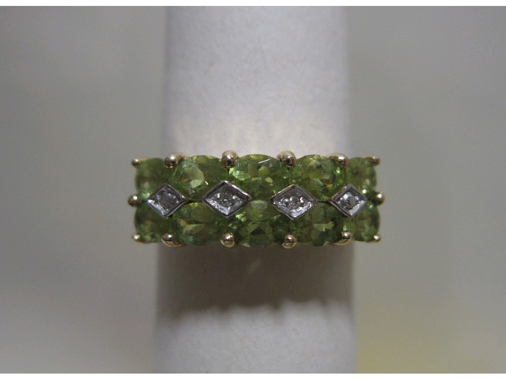 Appraisal: Nine carat gold peridot and diamond set dress ring