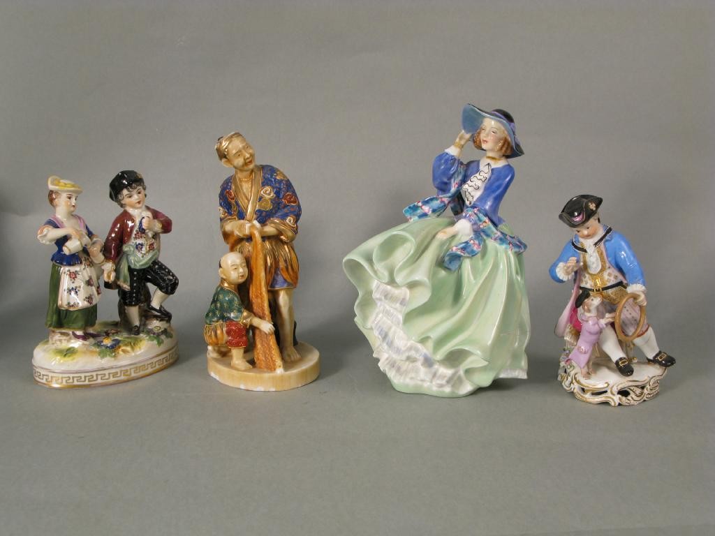 Appraisal: Four porcelain figures Chinaman with fishing nets in Meissen figure