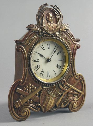 Appraisal: Dewey commemorative clock brass front cast iron back with balanced