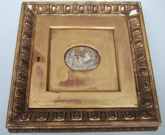 Appraisal: An oval carved shell cameo of a figure of Cupid