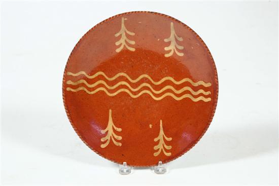 Appraisal: REDWARE PIE PLATE American mid th century Coggled rim and