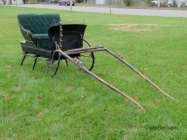 Appraisal: Victorian two-person sleigh with black paint decoration and dark green