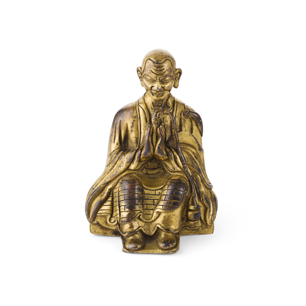 Appraisal: GILT-BRONZE FIGURE OF A SEATED LUOHAN the figure shown seated