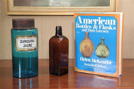 Appraisal: TWO DRUGGIST BOTTLES An amber Dr J Hostetters Stomach Bitters