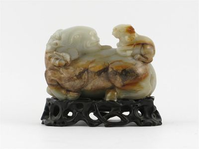 Appraisal: A Chinese nephrite jade carving of a recumbent ram with