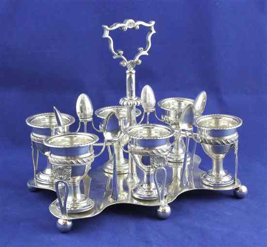 Appraisal: An Edwardian silver egg cruet stand the rectangular open wirework