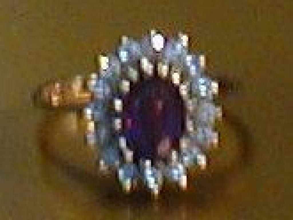 Appraisal: A ct gold amethyst and cubic zirconia set cluster dress