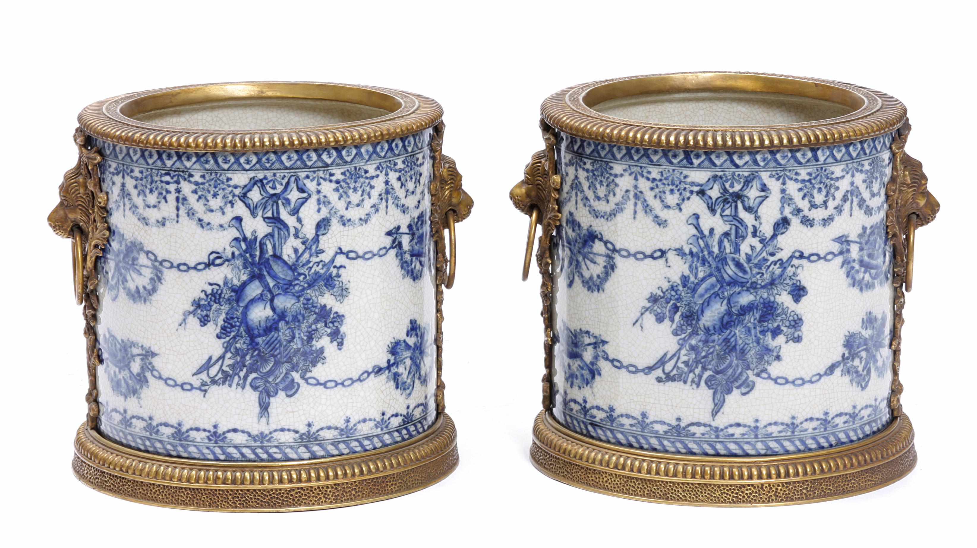 Appraisal: A pair of Neoclassical style gilt bronze mounted porcelain jardinires