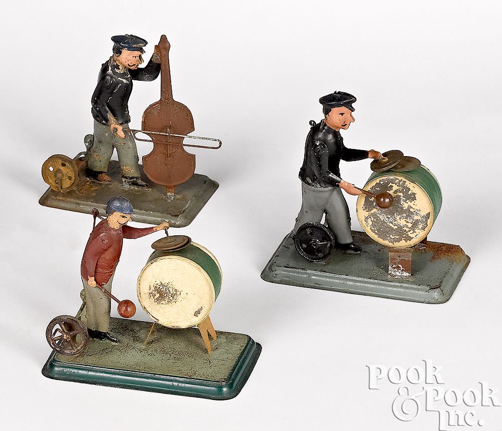 Appraisal: Three painted tin musician steam toy accessories Three painted tin