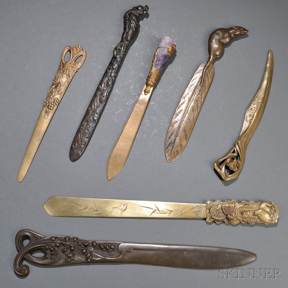 Appraisal: Seven Bronze Letter Openers th century one cast as a