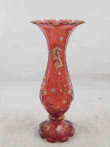 Appraisal: A Bohemian ruby glass vase decorated with enamel circa approx