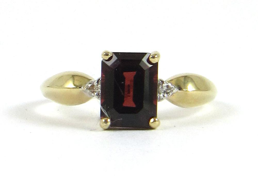 Appraisal: GARNET DIAMOND AND FOURTEEN KARAT GOLD RING The k yellow