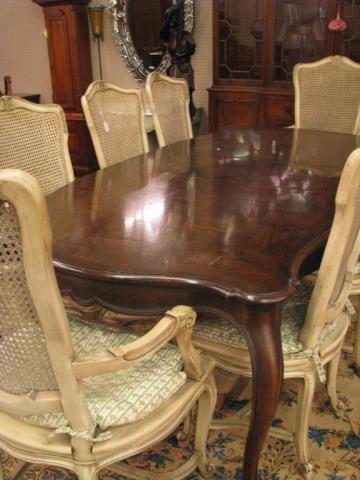 Appraisal: A French style dining table with parquet style top and