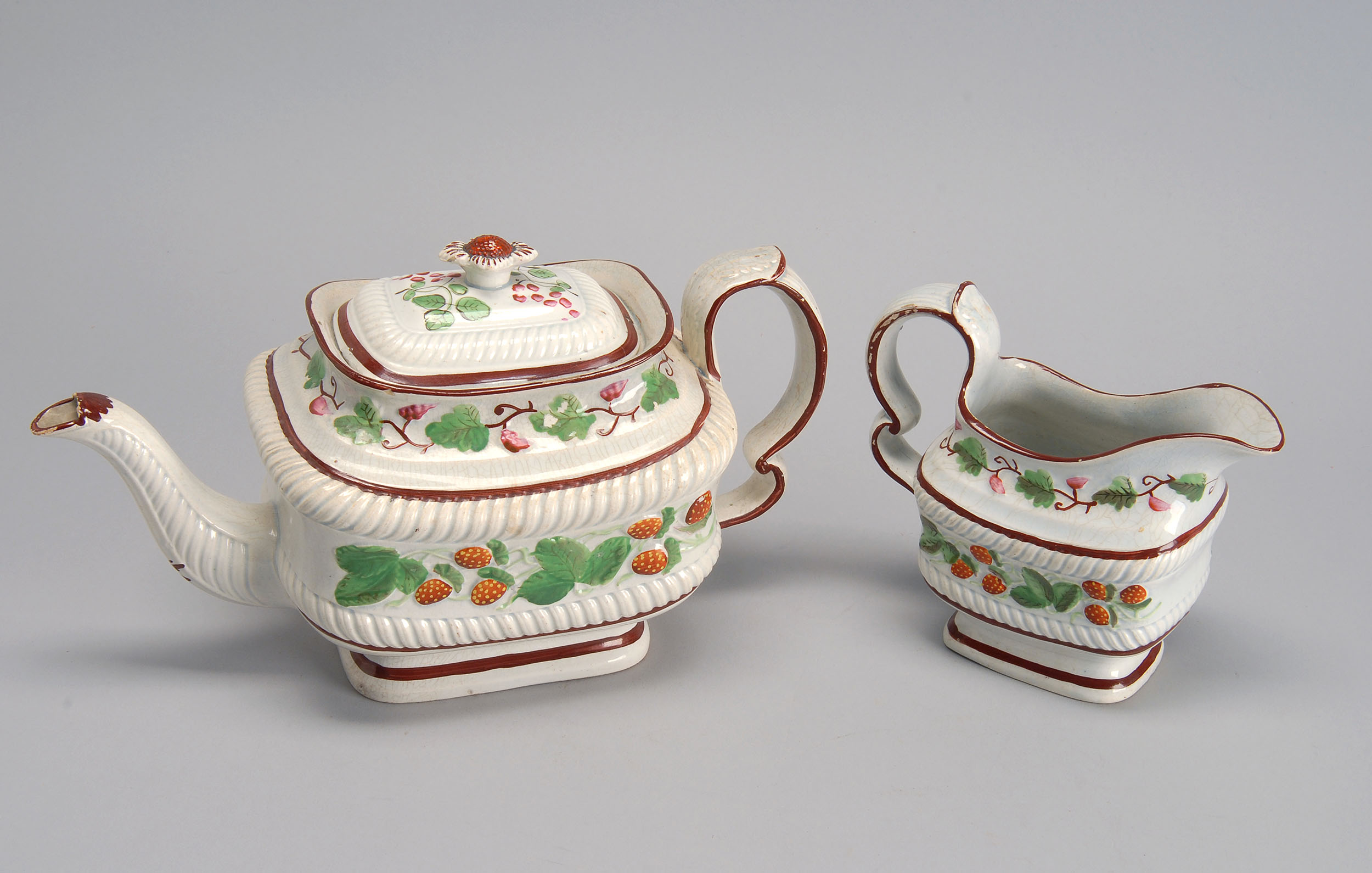 Appraisal: TWO PIECES OF TH CENTURY STRAWBERRY LUSTRE CHINA a teapot