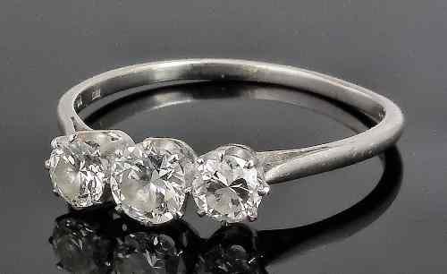 Appraisal: A modern platinum mounted three stone diamond ring the three