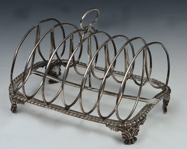 Appraisal: A GEORGE III SILVER SIX DIVISIONAL TOAST RACK with wirework