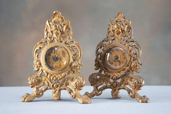 Appraisal: A pair of antique cast iron easel Clocks with embossed