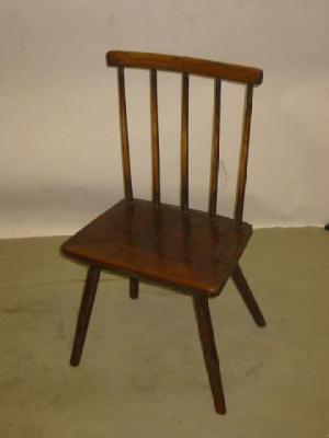 Appraisal: A PRIMITIVE ASH COMB BACK CHAIR with straight top rail