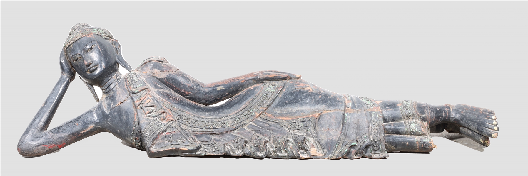 Appraisal: Large carved South East Asian figure in repose as is