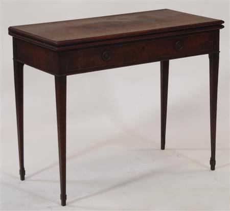 Appraisal: A George III mahogany foldover games table the rounded rectangular