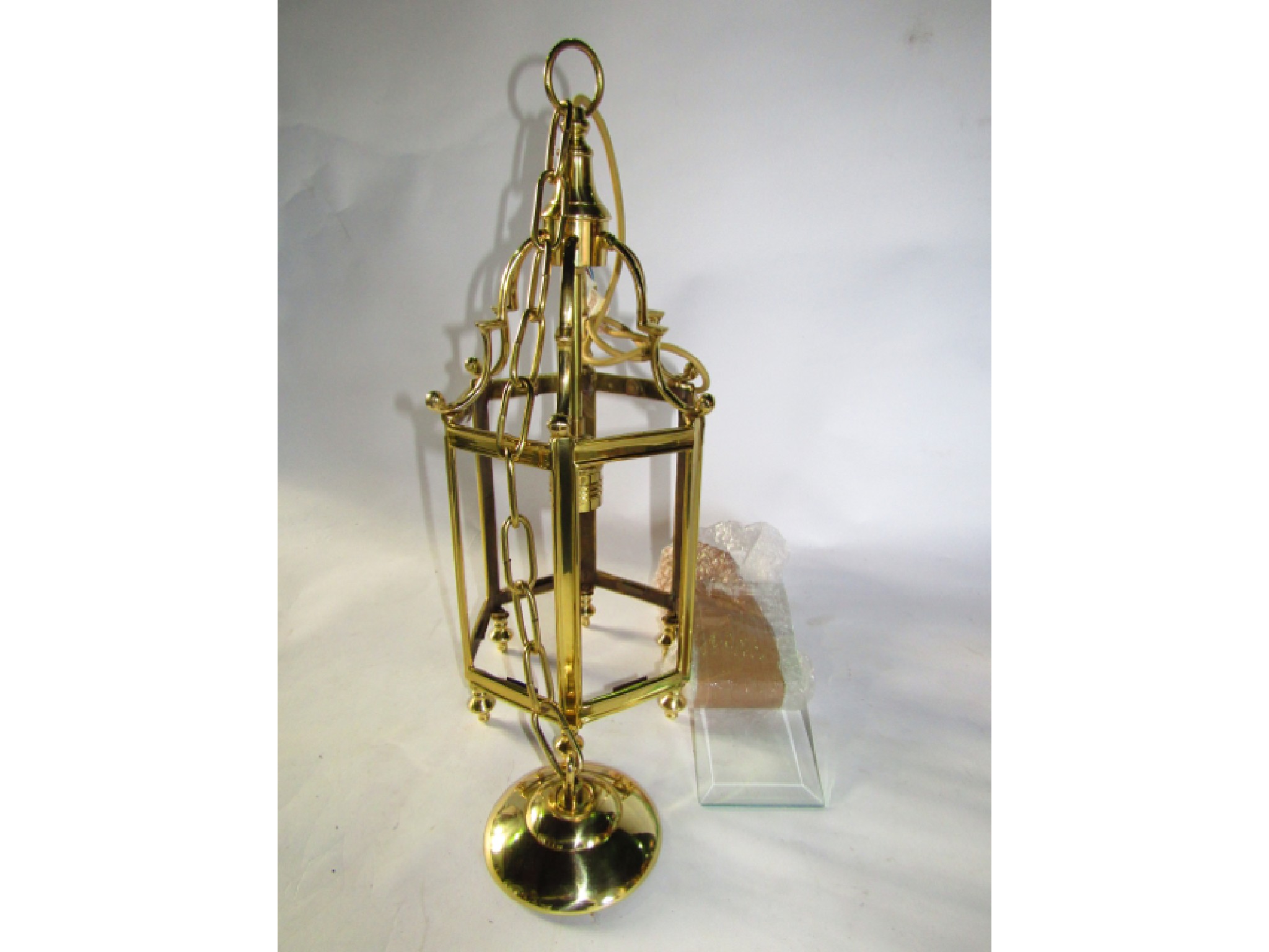 Appraisal: A Georgian style brass framed hexagonal ceiling lantern with clear