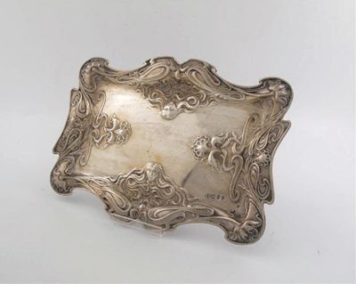 Appraisal: An Edwardian Art Nouveau dressing table tray embossed with masks