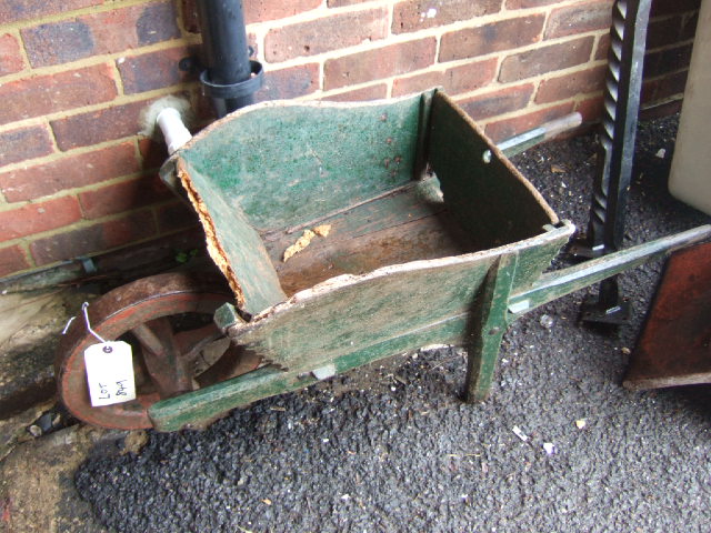 Appraisal: A green painted miniature wheelbarrow