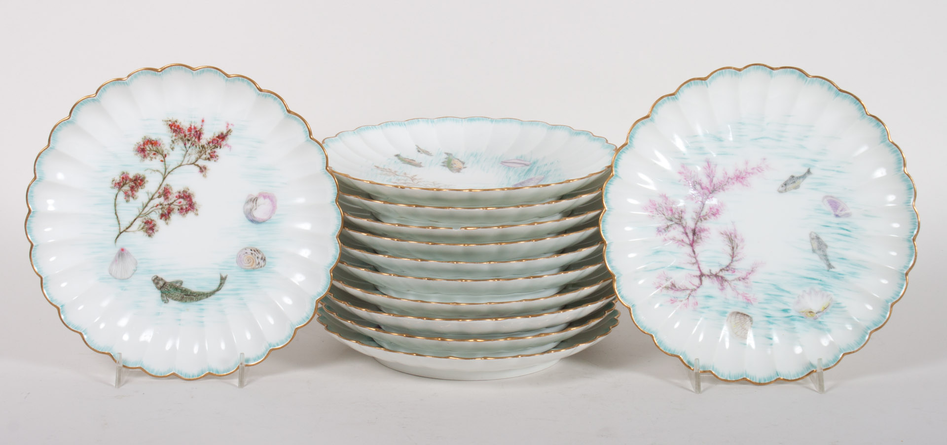 Appraisal: Haviland Limoges porcelain seafood plates dated each scalloped with hand-painted