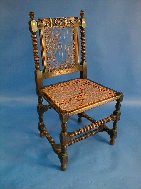 Appraisal: A set of four Jacobean style bobbin turned chairs with