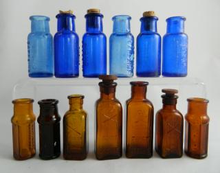 Appraisal: poison bottles Poison- amber square Kuhn KS- amber hexagonal Kuhn