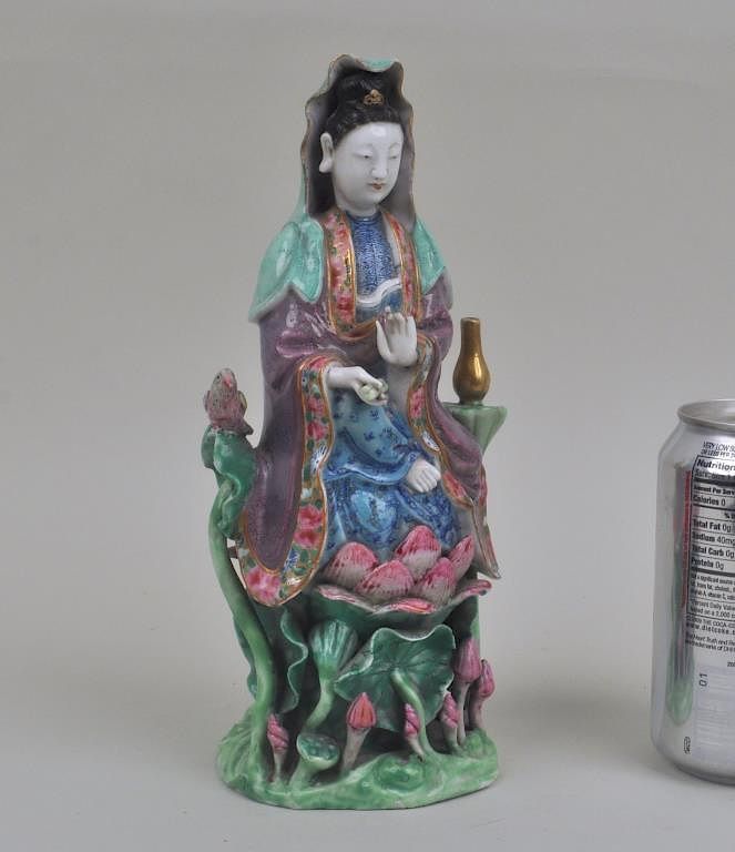 Appraisal: Chinese Porcelain Quan Yin Figure in elaborate dress seated on