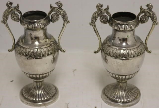 Appraisal: PAIR OF TH C EUROPEAN SILVER HANDLED URNS POSSIBLY GERMAN