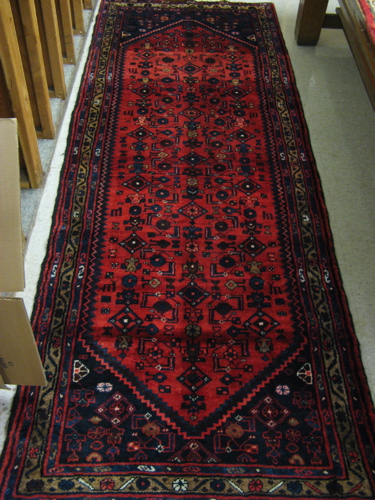 Appraisal: PERSIAN TRIBAL HALL CARPET northwester tribal overall Herati floral decoration