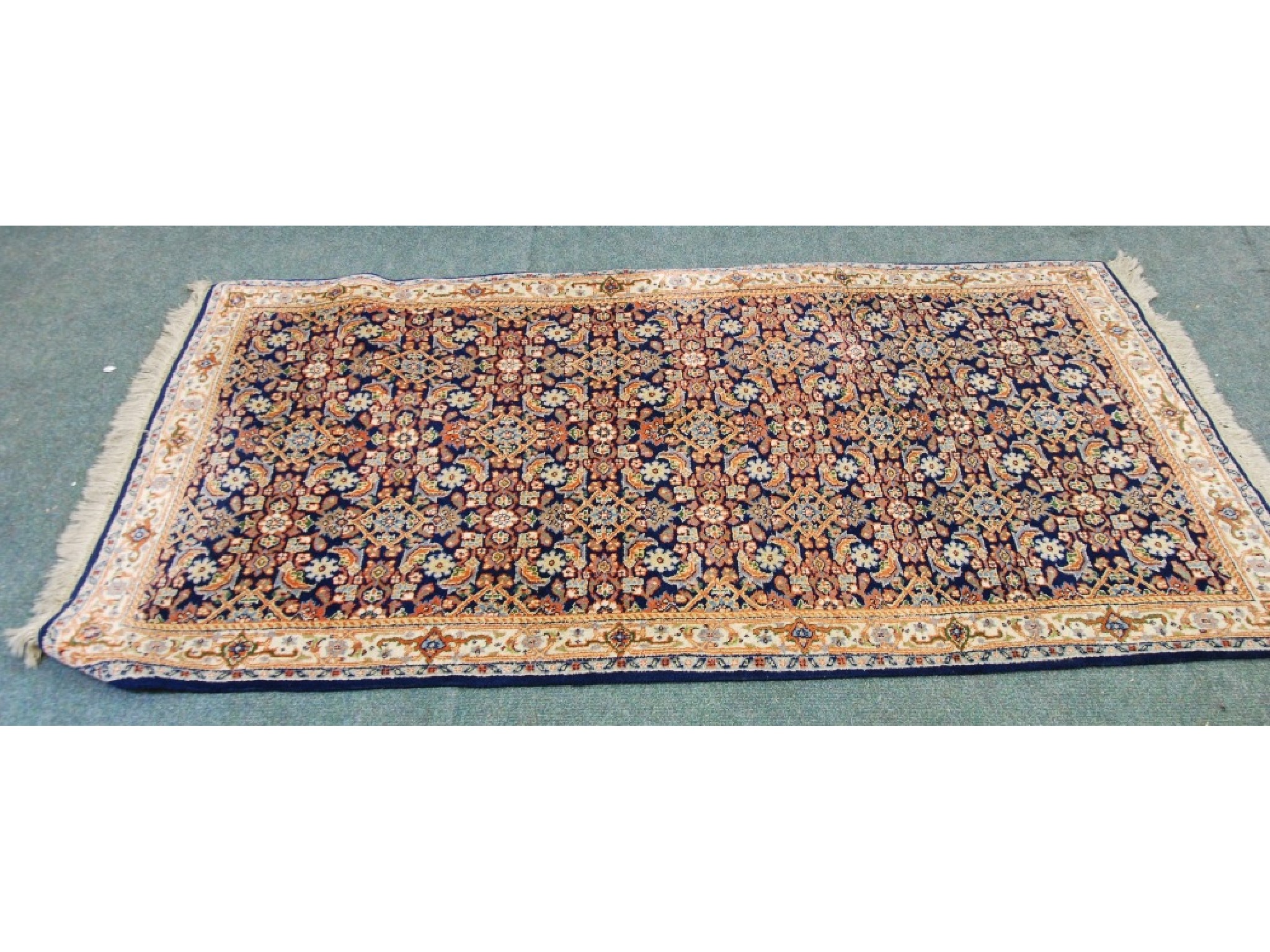 Appraisal: PERSIAN RUG with all-over herati design on a midnight blue