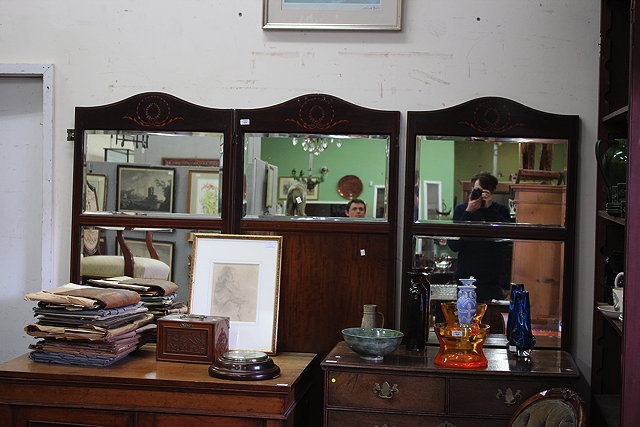 Appraisal: AN EDWARDIAN MAHOGANY AND MIRRORED THREE FOLD SCREEN with shaped