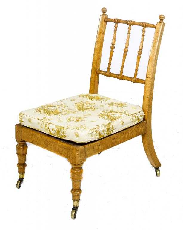 Appraisal: A VICTORIAN MAPLE NURSING CHAIR with turned finials and triple