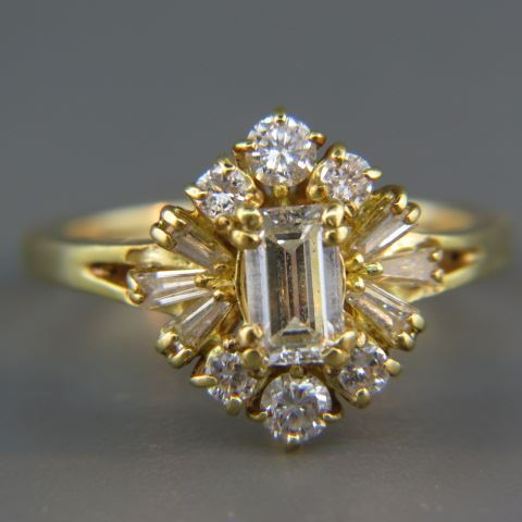 Appraisal: Diamond Ring emerald cut diamond weighing carat surrounded by round