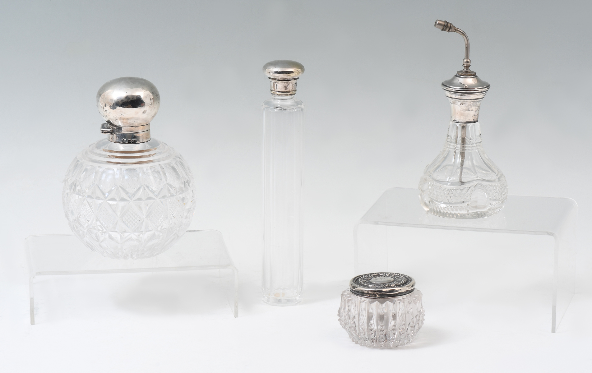 Appraisal: CUT GLASS VANITY BOTTLES WITH STERLING LIDS glass crystal dresser