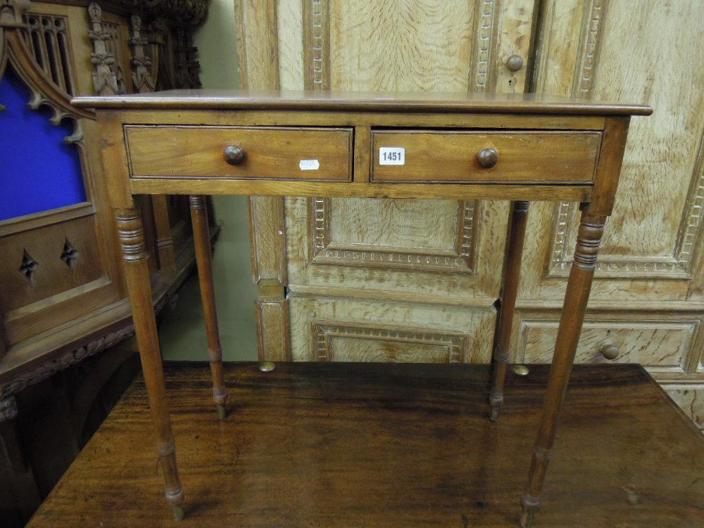 Appraisal: An early th century mahogany side table fitted with two