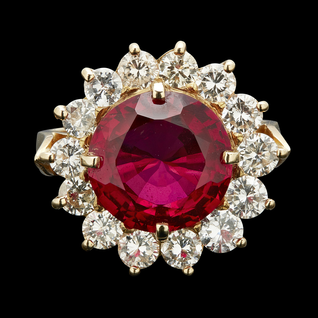 Appraisal: A ruby and diamond set cluster ringclaw set with a