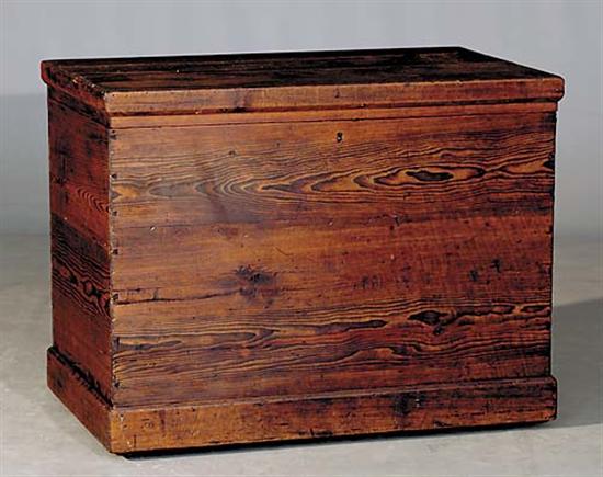 Appraisal: American pine trunk th centuryhinged top over dovetailed case on