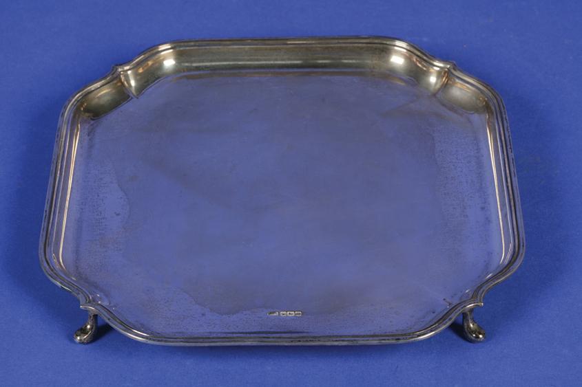 Appraisal: AN ART DECO SALVER of shaped square form with a