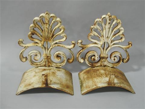 Appraisal: PAIR OF CAST IRON HOSE BIBS Each semicircular section topped