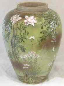 Appraisal: A large Oriental vase with applied flowers and underglaze birds