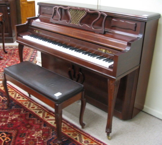 Appraisal: A MAHOGANY CASED CONSOLE PIANO WITH BENCH Kimball Piano Co