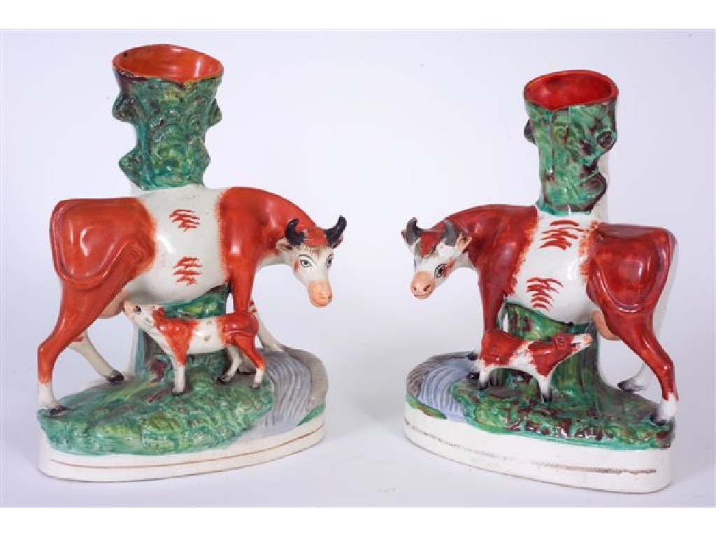 Appraisal: PAIR OF th CENTURY STAFFORDSHIRE COW AND CALF SPILL VASE