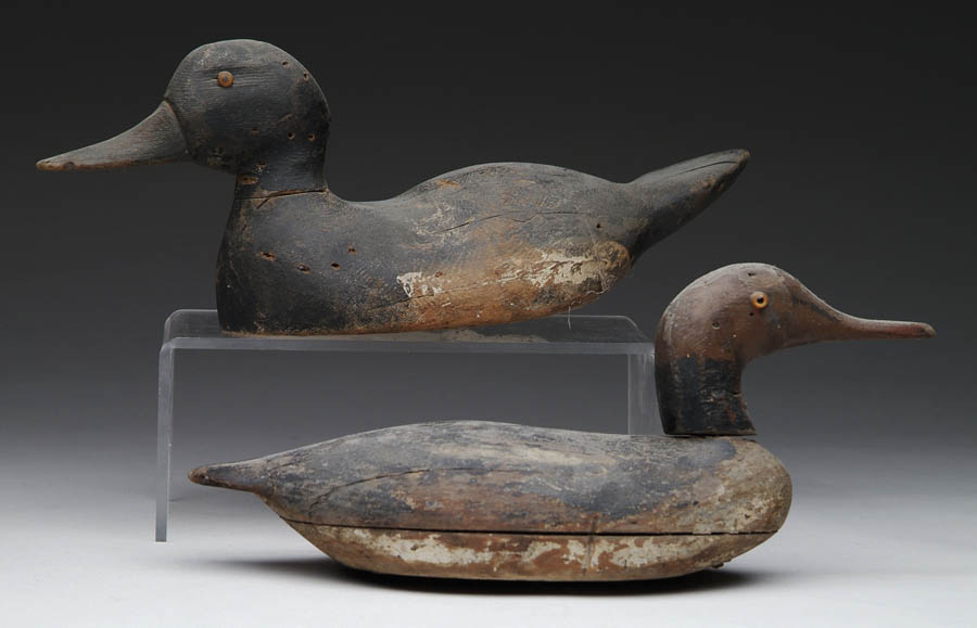 Appraisal: TWO CARVED AND PAINTED WORKING DECOYS l with red head