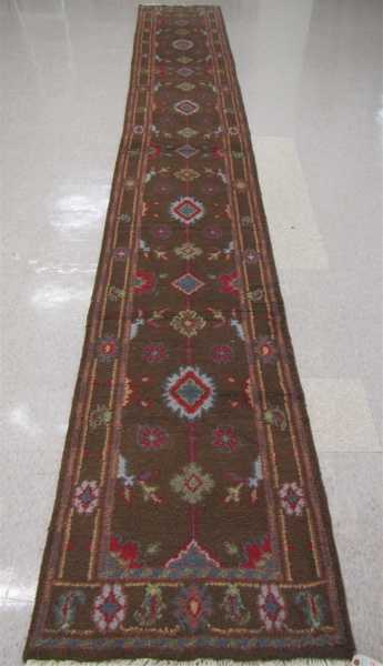 Appraisal: HAND KNOTTED ORIENTAL RUNNER Indo-Persian stylized floral pattern on rose